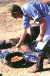 Camp Cook preparing the meal